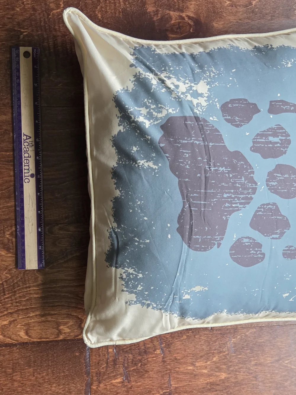Blue and Beige Decorative Throw Pillow with Rustic Paw Print